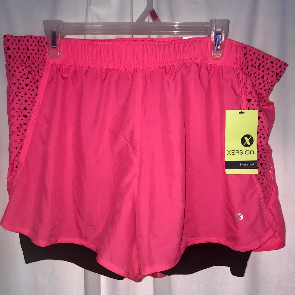 Neon pink lined athletic shorts